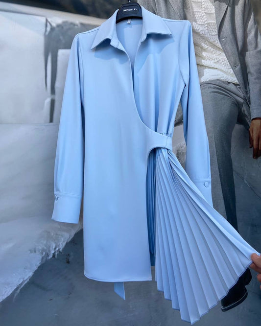 A blue pleated short dress with long sleeves and a collar, displayed on a mannequin.