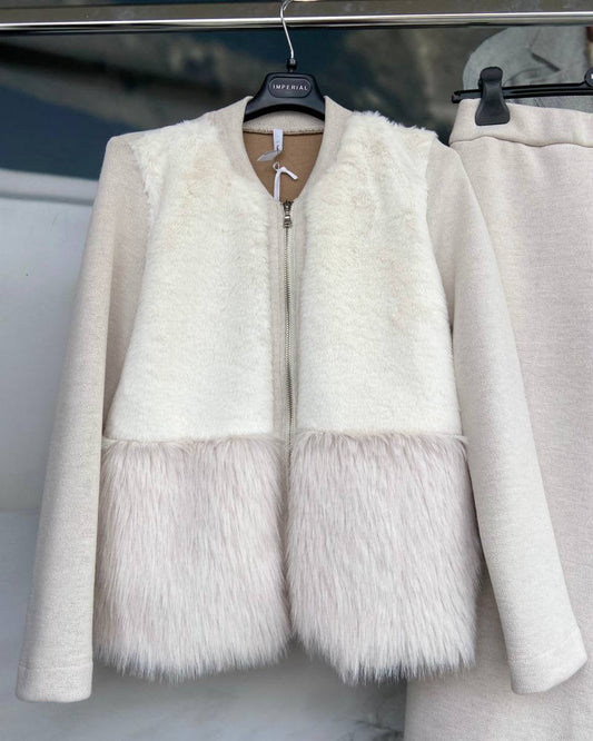 A white sweater with faux fur detailing and a zipper front.