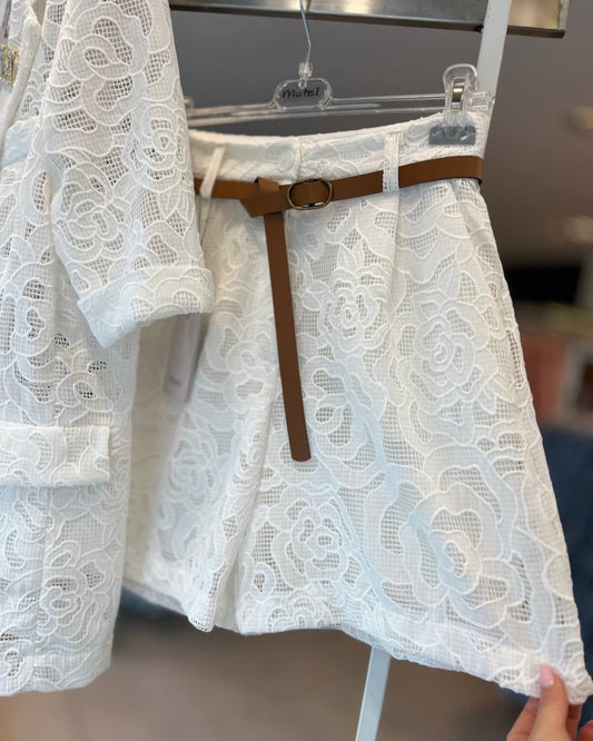 Lace shorts displayed on a hanger, with a brown belt tied around the waist.
