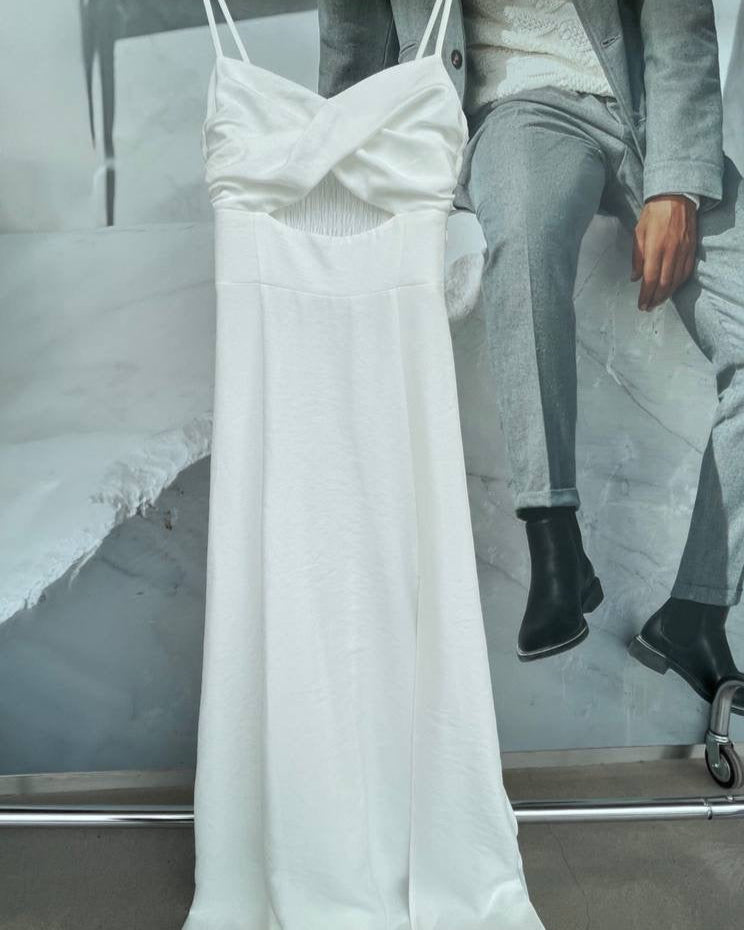 White dress on a hanger with a blurred background