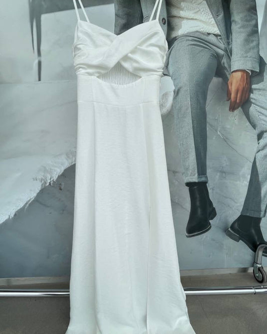 White dress on a hanger with a blurred background